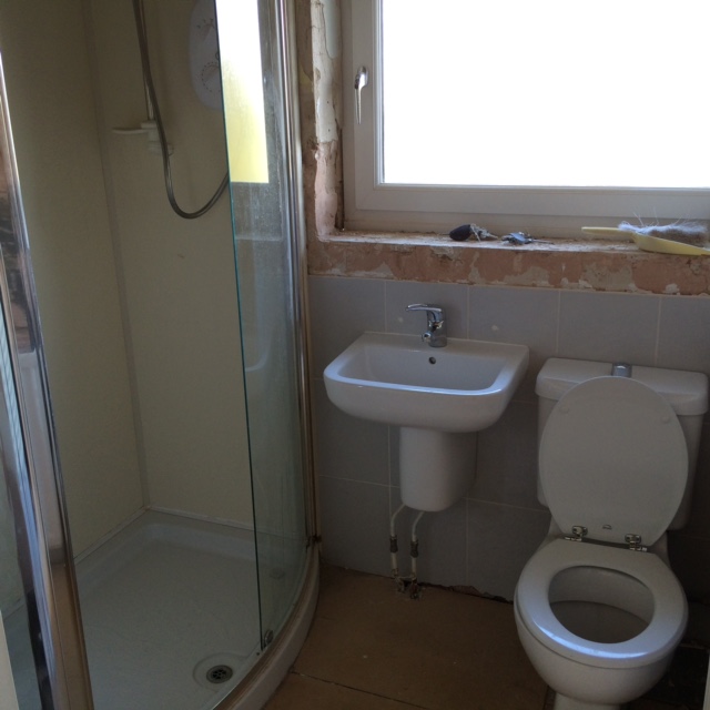 Picture of a bathroom being tiled by JR40 Plastering in Northampton